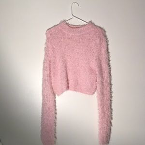 Fuzzy pink long sleeved crop top.
